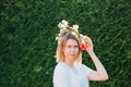 Beautiful blond woman in flower wreath. Summer solstice day. Midsummer.