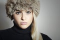 Beautiful Blond Woman in Fur Hat. Beauty Fashion Girl. Winter Style Royalty Free Stock Photo