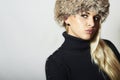 Beautiful Blond Woman in Fur Hat. Beauty Fashion Girl. Winter Style Royalty Free Stock Photo