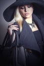 Beautiful Blond Woman in Hat with Handbag.Jewelry Royalty Free Stock Photo