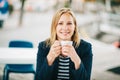 Beautiful blond woman having a break with cup of coffee Royalty Free Stock Photo