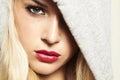 Beautiful blond woman in hood. red lips Royalty Free Stock Photo