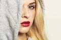 Beautiful blond woman in hood. red lips Royalty Free Stock Photo