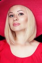 Beautiful blond woman with makeup, sensual lips wearing in red Royalty Free Stock Photo