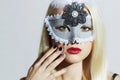 Beautiful Blond Woman in Mask.Young Girl with red lips.Manicure Royalty Free Stock Photo