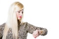 Beautiful blond woman portrait checking wrist watch Royalty Free Stock Photo