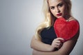 Beautiful Blond Woman with Red Heart. Beauty Girl. Show Love Symbol. Valentine's Day.Passion Royalty Free Stock Photo