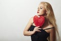 Beautiful Blond Woman with Red Heart. Beauty Girl. Show Love Symbol. Valentine's Day.Passion Royalty Free Stock Photo