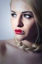 Beautiful Blond Woman with Tress.Beauty Red Lips.Valentines Day.Professional Make-up. Freak Girl with Heart on the Lips