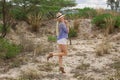 Beautiful blond woman wearing the hat outdoors in the prairie Royalty Free Stock Photo