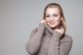Beautiful blond young girl wears winter pullover Royalty Free Stock Photo