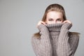 Beautiful blond young girl wears winter pullover Royalty Free Stock Photo