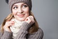 Beautiful blond girl wears winter scarf and hat Royalty Free Stock Photo