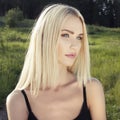 Beautiful Blond young Woman in Forest Royalty Free Stock Photo