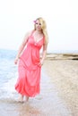 Beautiful blonde ashore epidemic deathes in rose gown Royalty Free Stock Photo