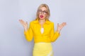 Business woman in yellow suit and eyeglasses Royalty Free Stock Photo