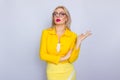 Business woman in yellow suit and eyeglasses Royalty Free Stock Photo