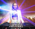 Beautiful blonde DJ girl on decks - the party,