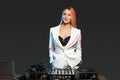 Beautiful blonde DJ girl on decks - the party Royalty Free Stock Photo