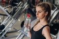 Beautiful blonde drinking water in the gym Royalty Free Stock Photo