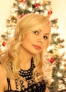 Beautiful blonde in front of christmas tree