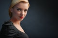 Beautiful blonde girl on dark background Royalty Free Stock Photo