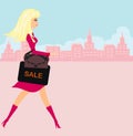 Beautiful blonde girl doing shopping in the city Royalty Free Stock Photo