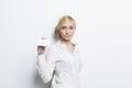 Beautiful blonde girl holding blank business card Royalty Free Stock Photo