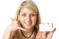 Beautiful blonde girl holding a white card. Royalty Free Stock Photo