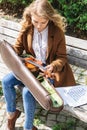 Beautiful blonde girl holds violin in autumn park Royalty Free Stock Photo