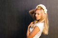 Beautiful blonde girl in the studio. With a wreath on his head Royalty Free Stock Photo