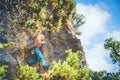 Girl climbing a rock