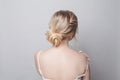 Beautiful blonde hairstyle, female back and head on white background