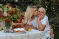 Horizontal close-up photo of a happy ninety year old woman with her beloved granddaughter