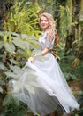 Beautiful blonde long hair girl in a flying tulle skirt Royalty Free Stock Photo