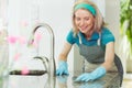 Woman cleaning kitchen work surface