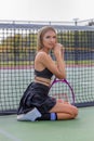 A Lovely Blonde Model Plays Tennis On A Hot Summers Day