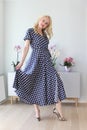 Beautiful blonde in polka dot dress Royalty Free Stock Photo