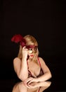 Beautiful blonde with a red mask Royalty Free Stock Photo