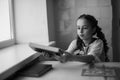 Beautiful blonde schoolgirl with books in the school Royalty Free Stock Photo