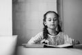 Beautiful blonde schoolgirl with books in the school Royalty Free Stock Photo