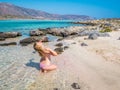 Beautiful blonde sexy curvy girl body on the paradise beach of Elafonisi, Crete, Greece.