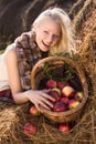 Beautiful blonde smiling woman with many apple