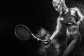 Beautiful blonde sport woman tennis player with racket in red costume Royalty Free Stock Photo