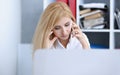 Beautiful blonde thoughtful businesswoman talk cellphone Royalty Free Stock Photo