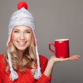 Beautiful blonde woman with an aromatic hot coffee in hand. Royalty Free Stock Photo