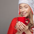 Beautiful blonde woman with an aromatic hot coffee in hands. Royalty Free Stock Photo