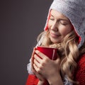 Beautiful blonde woman with an aromatic hot coffee in hands. Royalty Free Stock Photo