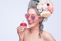 Beautiful blonde woman with a cake. Sweet lady with heart glasses. Vintage style. Fashion photo Royalty Free Stock Photo