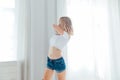 beautiful blonde woman dancing to music in training Royalty Free Stock Photo